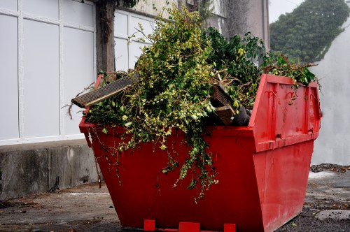 Team members clearing garden debris